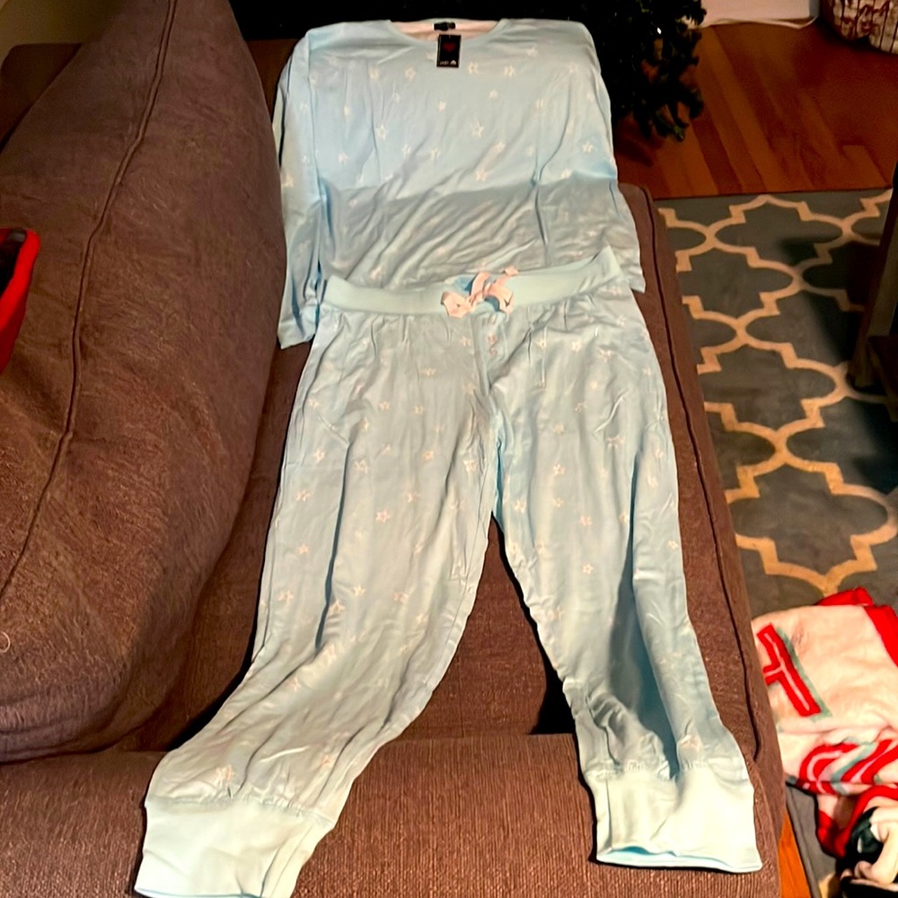 A  large pair of baby blue pajamas with white stars on them.